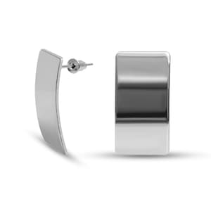 May include: A pair of silver earrings with a rectangular shape. The earrings are made of a smooth, shiny metal.