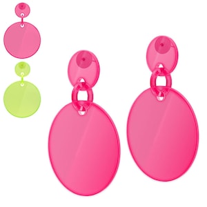 May include: A pair of pink acrylic earrings with a circle design. The earrings have a small circle at the top, followed by a larger circle, and then a larger circle at the bottom.