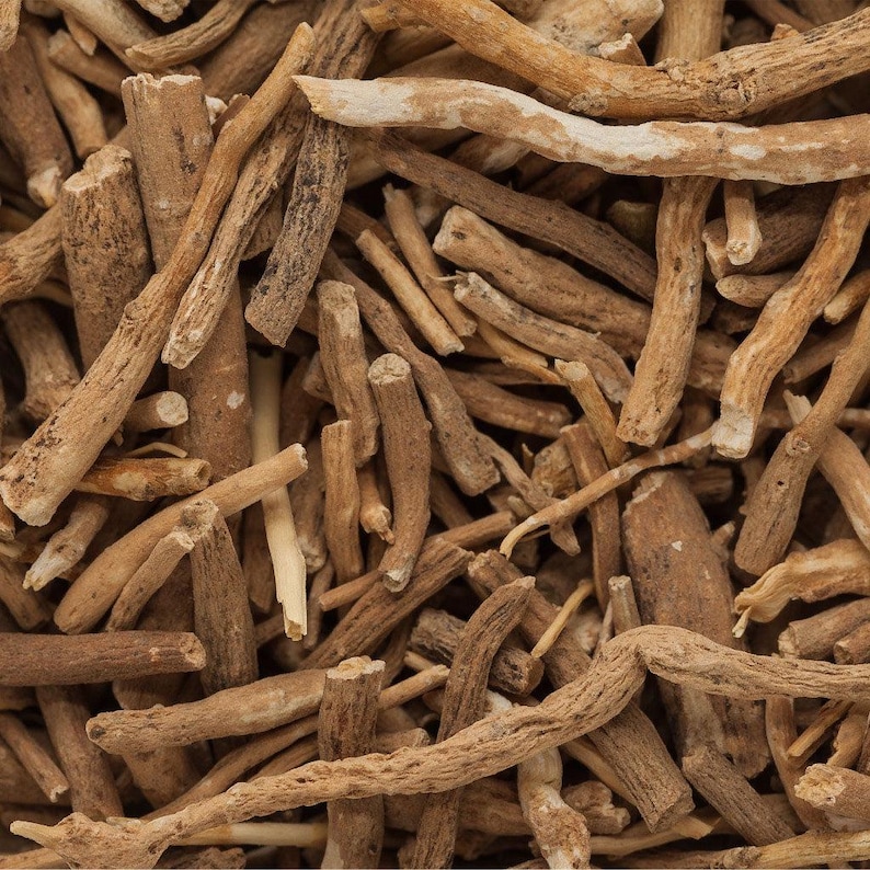 May include: A close-up image of a pile of dried brown roots. The roots are thin and long, and they are all tangled together.