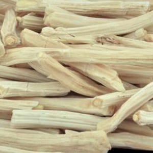 May include: A pile of dried, light brown, thin, and long sticks of Shatavari root.