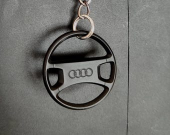 Audi-stuurwielsleutelhanger, zwart plastic autoaccessoire, realistisch autogevoel