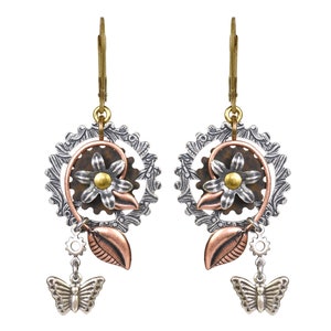 May include: Silver and copper steampunk earrings with a flower design, gears, and a butterfly charm.