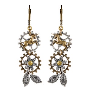 May include: Steampunk-style earrings featuring a gold unicorn within a silver gear, connected to a bronze gear with a flower and silver leaves. The earrings have a lever back closure and are made of mixed metals.