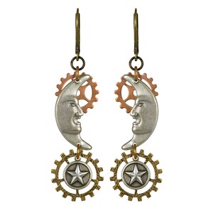May include: A pair of steampunk-style earrings. Each earring features a silver crescent moon with a smiling face, a copper-colored gear, and a lower pendant with a star inside a gear-shaped frame. The earrings have bronze-colored ear wires.