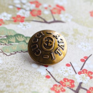 Vintage Gucci Copper metal Buttons.