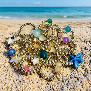 Anelli personalizzati con perline, placcati in oro, placcati in argento, con pietre preziose, conchiglie, stelle e cuori.
