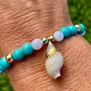 Turquoise Blue & White Shell Charm Beaded Bracelet. Made with White Shell and Turquoise Shell Beads with 14k Gold Filled Accent Beads.