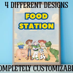 May include: A framed poster with the words "FOOD STATION" in yellow and blue, featuring cartoon characters. The poster includes the text "4 DIFFERENT DESIGNS" and "COMPLETELY CUSTOMIZABLE". The characters include a green alien, a cowboy, Buzz Lightyear, Jessie, a dinosaur, and a pig.