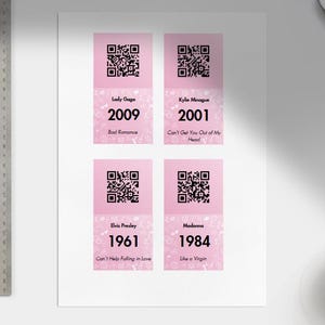 May include: Four pink cards with QR codes and text. The cards feature Lady Gaga (2009), Kylie Minogue (2001), Elvis Presley (1961), and Madonna (1984). Each card displays the artist's name, the year, and a song title.
