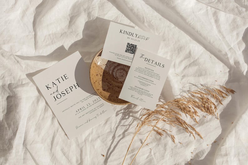 May include: Wedding invitation suite with a minimalist design. The invitation card features the names "Katie and Joseph" and the date "April 23, 2023". The RSVP card has a QR code and the text "Kindly RSVP by 01.01.2023". The details card lists the ceremony and reception locations.