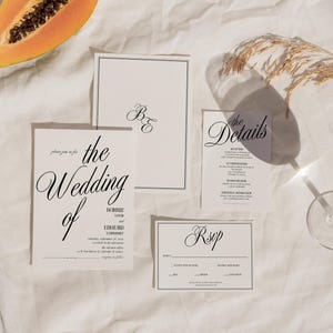 May include: Wedding invitation suite with a white background. The invitation cards feature black text with the words "the wedding of" and "RSVP".