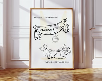 May include: A framed black and white illustration for a wedding. The artwork features the text "WELCOME TO THE WEDDING OF MAXINE & JOEY" above a drawing of a couple dancing. A disco ball hangs in the center, and the text "WE'RE SO HAPPY YOU'RE HERE!" is at the bottom.
