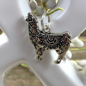 May include: Silver charm of a llama with intricate details, perfect for adding a touch of whimsy to a keychain or bracelet.