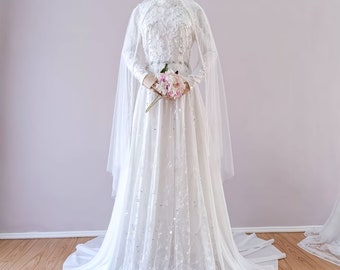 Robe de mariée Arunika : robe de mariée élégante avec un voile glamour sans contact