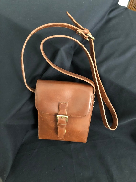 rectangular red-brown leather crossbody with bras… - image 1