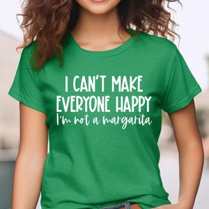 May include: Green t-shirt with white text that reads "I can't make everyone happy I'm not a margarita".