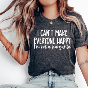 May include: A dark gray t-shirt with the text "I can't make everyone happy I'm not a margarita" printed in white.