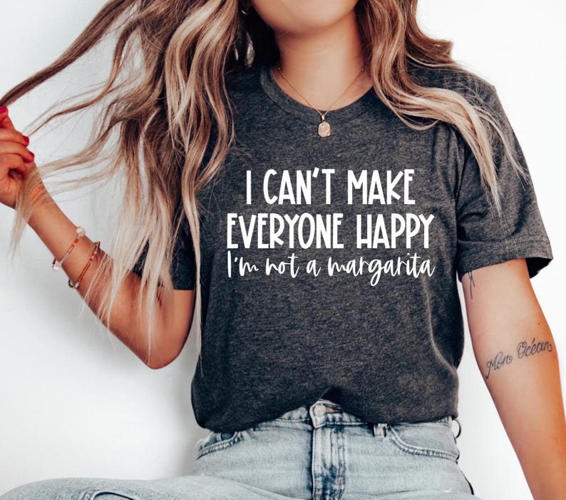 May include: A dark gray t-shirt with the text "I can't make everyone happy I'm not a margarita" printed in white.
