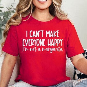 May include: Red t-shirt with white text that reads "I can't make everyone happy I'm not a margarita".