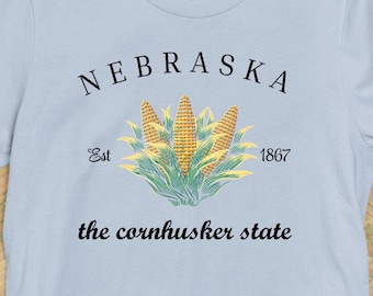 Nebraska el estado de Cornhusker, maíz estatal, maíz en la mazorca, NE mejor maíz del país, mudanza a Nebraska camiseta gráfica