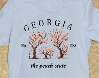 Georgia der Pfirsich-Zustand, GA-Pfirsichbäume, Pfirsiche in Georgia, GA Zustand-Slogan-T-Shirt