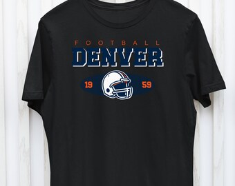 May include: Black t-shirt with a white and blue graphic of a football helmet and the text "FOOTBALL DENVER 19 59".
