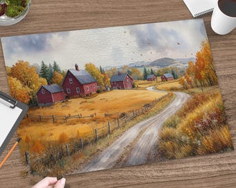 May include: A rectangular jigsaw puzzle featuring a landscape painting of red barns in a golden autumn field with a winding dirt road, surrounded by yellow trees and distant hills under a cloudy sky, with a hand placing a final puzzle piece.
