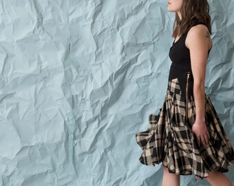 Flowy plaid circle skirt. Multi-season fashionable skirt w two generous side pockets and a tall stretchy waistband for function and comfort.