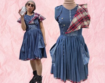 Blues and plaid, chambray dress made in all sizes. Cotton denim blue chambray w red plaid accents. Adjustable neckline & sleeves with snaps.