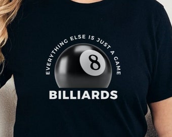 May include: A black t-shirt with a white graphic of a billiard ball with the number 8 on it. The text around the ball reads "Everything else is just a game" and "Billiards".