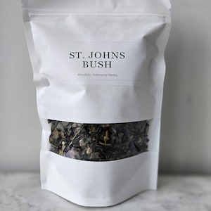 May include: A white resealable pouch with a clear window showing dried St. John's Bush herbs. The pouch has a label that reads "St. John's Bush" and "Wholistic Harmony Herbs".