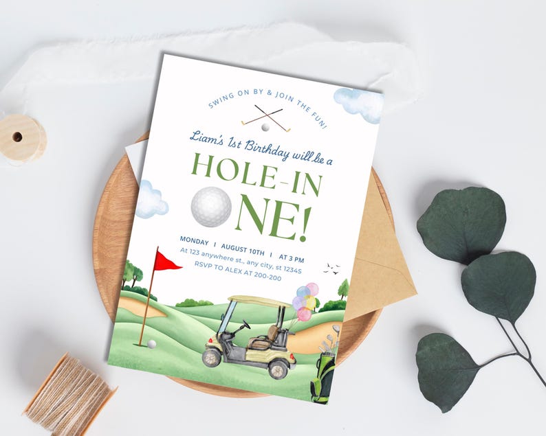 May include: A golf-themed birthday invitation featuring a green and white golf course, a golf buggy, and a golf ball. The text reads "Liam's 1st Birthday will be a Hole-in-One!" with the date and time of the party below.