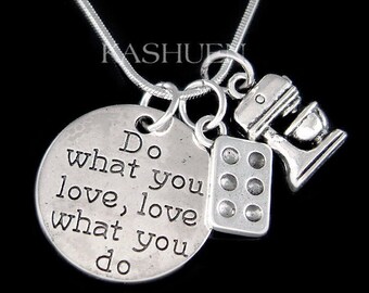May include: Silver necklace with a charm that says "Do what you love, love what you do" and two other charms, one of a kitchen mixer and one of a muffin tin.