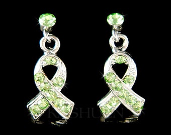 May include: A pair of silver dangle earrings with green crystal ribbon charms. The earrings are a symbol of support and awareness.