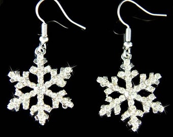 May include: Silver snowflake earrings with clear crystal accents.