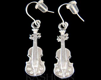 May include: Silver violin-shaped earrings with clear crystal accents. The earrings have a hook closure.