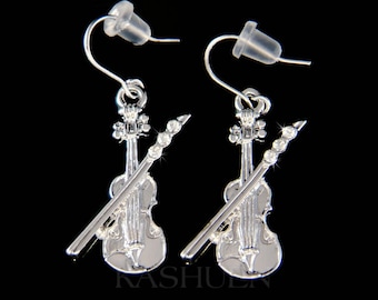 May include: Silver tone violin earrings with clear crystal accents. The violin is a popular musical instrument.