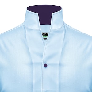 May include: A light blue dress shirt with a mandarin collar and a purple inner collar. The shirt has a single button closure and a small label that reads "The Clothier London Green Label 100% Cotton".