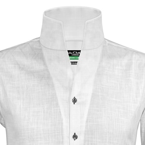 May include: White linen shirt with a mandarin collar and a button-up front. The shirt has a textured weave and a label that reads "John Cloth London Green Label Linen".