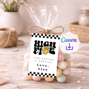 May include: A clear plastic treat bag filled with pastel candies, tied with a brown twine bow. A rectangular tag features a black and white checkered border, the text HIGH FIVE, a yellow hand icon, and the text FOR MAKING IT SPECIAL Love, Alex.