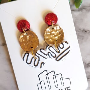 black and white heart dangle earring with gold and red