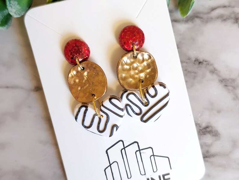 black and white heart dangle earring with gold and red