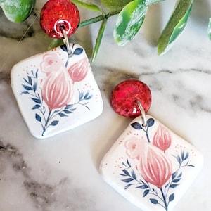 red glitter and floral earring