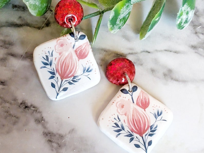 red glitter and floral earring