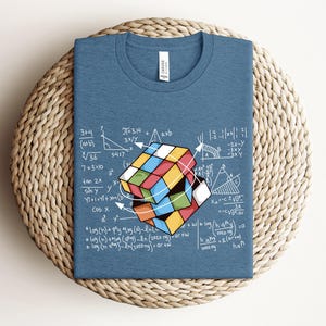 a t - shirt with a picture of a cube on it