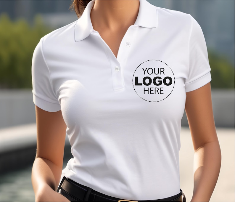 A woman wearing a white polo shirt with a logo on the front.