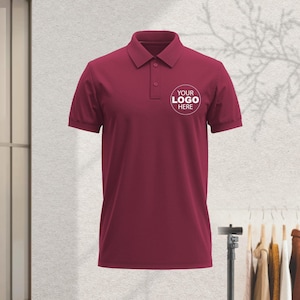 A maroon polo shirt with a white logo on the left side of the chest.