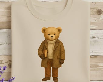 Sudadera acogedora con diseño de oso lector, ilustración gráfica.