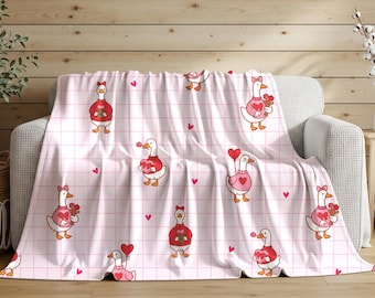 Valentinstagsdecke mit Gänsen und Herzen | Verspielte rosa Plüschdecke | Niedliche romantische Dekoration als Geschenk für Verliebte
