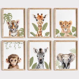 May include: Set of six framed art prints featuring watercolor illustrations of jungle animals. Includes a tiger, giraffe, lion cub, monkey, zebra, and elephant, each surrounded by greenery. The frames are a light brown color.